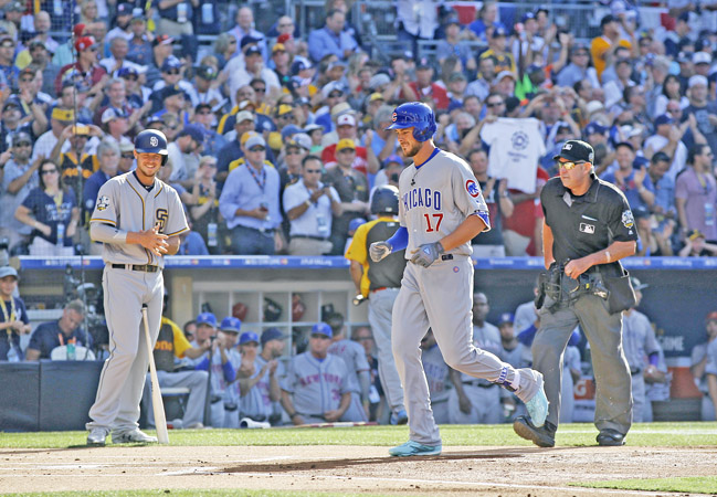 The Chicago Cubs' Kris Bryant crosses home plate as the San Diego Padres' Wil Myers, left, looks after a first-inning home run in the All-Star Game at Petco Park in San Diego on Tuesday. (K.C. Alfred/San Diego Union-Tribune/TNS)