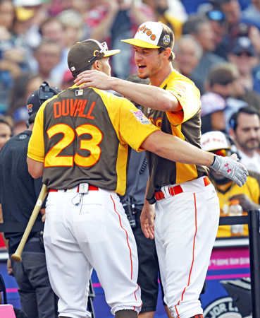 San Diego Padres' Wil Myers congratulates Cincinnati Reds' Adam Duvall, who eliminated him in the All-Star Home Run Derby at Petco Park in San Diego on Monday. (K.C. Alfred/San Diego Union-Tribune/TNS)