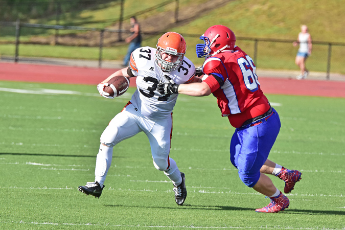 Ironton FIghting Tigers’ senior running back Chase Rowe (37) fights off a Portsmouth Trojans’ defender during the Ohio Valley Conference preview. Ironton opens the regular season on Friday at Wheelersburg. (Kent Sanborn of Southern Ohio Sports Photos)