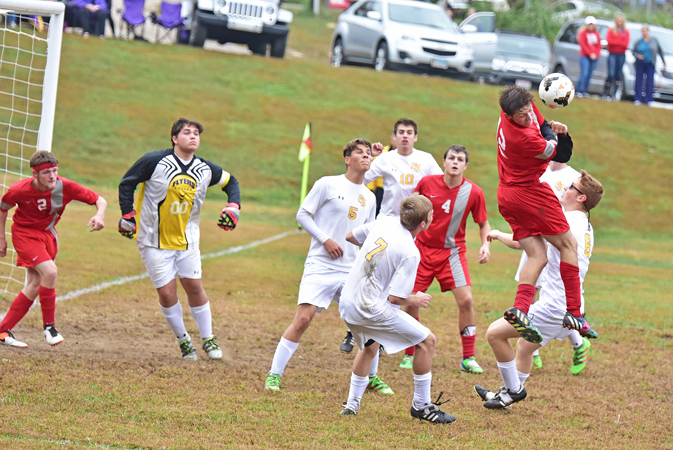 The St. Joseph Flyers’ defense of goalkeeper Bradley Rist (00), Blake McKee (5), Clay Willis (10), Blake Balestra (7) and Daniel Hodges (6) surround a New Boston player during Saturday’s Division III sectional tournament soccer game. The Flyers won 6-1. (Kent Sanborn of Southern Ohio Sports Photos)