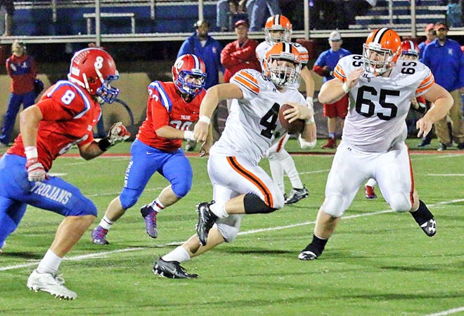  Ironton Fighting Tigers fullback Seth Fosson (45) runs through the Portsmouth defense for some of his 184 yards. Ironton beat Portsmouth 43-28 on Friday to win their second straight outright Ohio Valley Conference title. (Tim Gearhart of Tim’s News & Novelties, Park Ave. in Ironton)