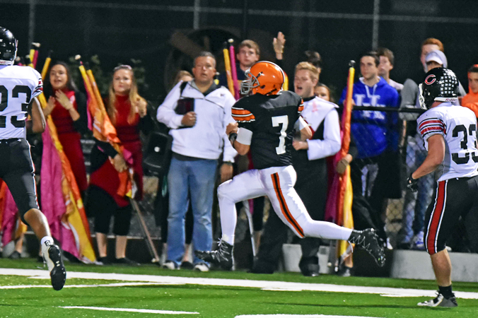 Ironton Fighting TIgers' quarterback Jake Isaac (7) races down the sidelines and into the end zone on a 38-yard touchdown run as time expired to end the first half. The score proved to be the difference as Ironton edged the Coal Grove Hornets 14-12 on Friday in a key Ohio Valley Conference game. (Kent Sanborn of Southern Ohio Sports Photos)