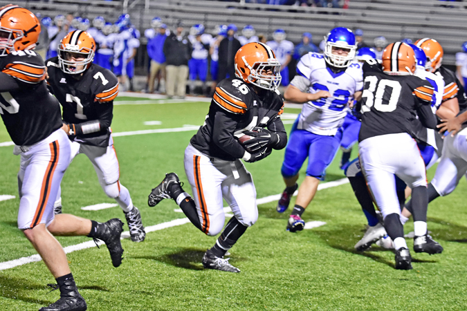 Ironton Fighting Tigers’ running back Jaxson Pleasant runs through a big hole in the Gallaipolis defense for a 15-yard gain during last week’s game. Ironton visits Portsmouth in the regular season finale and needs a win to secure a playoff berth and the OVC outright title. (Kent Sanborn of Southern Ohio Sports Photos)