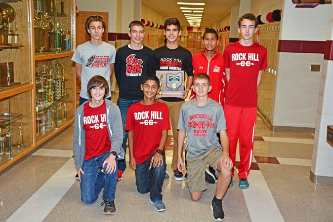 The Rock Hill Redmen cross country team won its second straight Ohio Valley Conference championship this season and finished second at the Division III district meet to qualify for the regional tournament on Saturday. Team members going to the regionals meet are: front from left to right, Logan Boggs, Jasson Aguilera and Nick Blankenship; second row from left to right, Eli Baker, Brady Floyd, Brendon McCormick, Victor Aguilera and Ethan Miller. (Kent Sanborn of Southern Ohio Sports Photos)