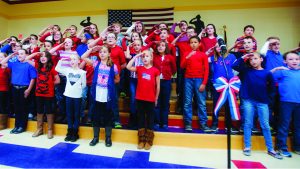 Jessica St. James/The Tribune Fourth grade students perform songs such as “American Tears,” “Johnny Comes Marching Home,” “All American,” and many more during a special Veterans Day program at Chesapeake Elementary School.