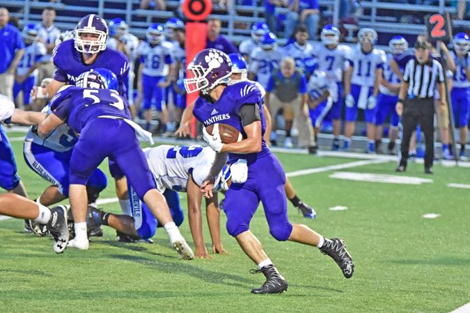 Chesapeake Panthers’ senior quarterback runs behind the block of Brendan Meadows (52) during a game against Gallipolis. The Panthers host Barnesville at 7:30 p.m. Friday in the Division VI Region 23 quarterfinals of the OHSAA playoffs. (Kent Sanborn of Southern Ohio Sports Photos)
