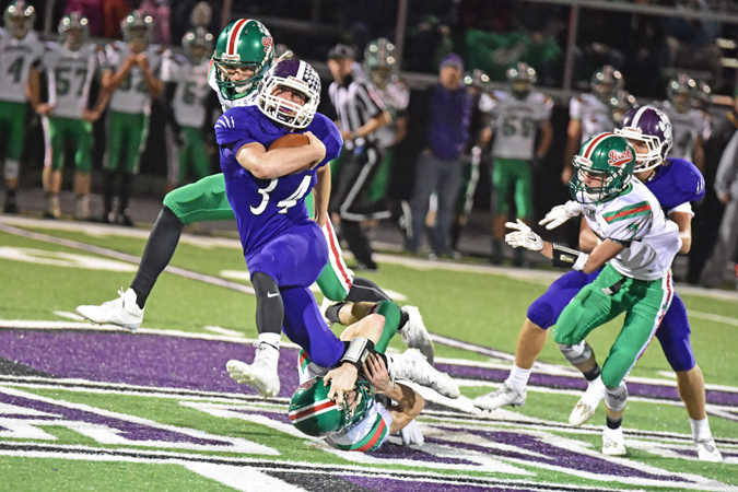 Chesapeake Panthers’ fullback Will Scott (34) tries to slip through a tackle by a Barnesville defender during Friday’s Division VI Region 23 quarterfinal game. The Panthers lost 41-22. (Kent Sanborn of Southern Ohio Sports Photos)