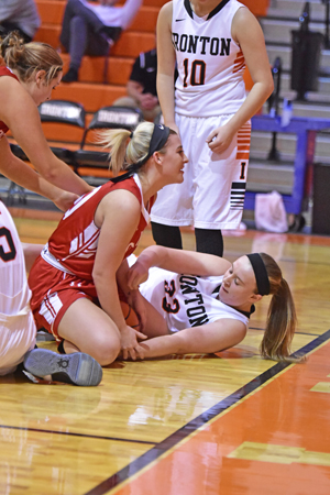 ironton Fighting Tigers’ Katie Boyer (right) battles Rock Hill Redwomen’s Anna Darby (left) for control of the basketball. Ironton downed the Redwomen 63-37 on Monday in an Ohio Valley Conference game. (Kent Sanborn of Southern Ohio Sports Photos)