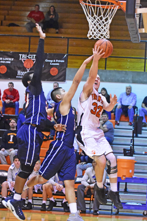 Ironton Fighting Tigers’ Charlie Large (32) fights the Wesley Christian defense to score inside during Friday’s game of the Western & Southern Life Insurance Ironton Classic. Large had 12 points as the Fighting Tigers won 60-54. (Kent Sanborn of Southern Ohio Sports Photos)