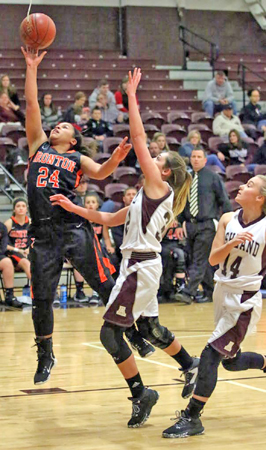Ironton Lady Fighting Tigers’ Alyssa Lewis (24) goes in for a layup as she scores two of her 11 points in a 53-25 win over the Ashland Kittens on Thursday. (Tim Gearhart of Tim’s News & Novelties, Park Ave. in Ironton)