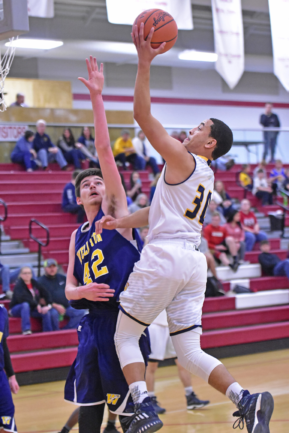 South Point Pointers’ Elijah Adams drives for a layup as he scores two of his game-high 20 points in a 59-46 win over Wellston on Wednesday in the Div. III sectional tournament. (Kent Sanborn of Southern Ohio Sports Photos)