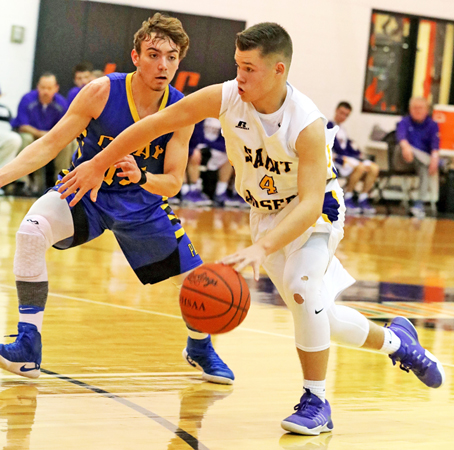 St. Joseph Flyers’ guard Isaac Whaley (4) pushes the ball up the court during Saturday’s game against Racine Southern. The Flyers couldn’t hold their lead in a 61-52 loss. (Tim Gearhart of Tim’s News & Novelties, Park Ave. in Ironton)